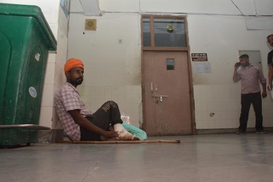 A patient waits outside a doctor’s room at the Amritsar civil hospital on Monday. (Sameer Sehgal/HT) A patient waits outside a doctor’s room at the Amritsar civil hospital on Monday. (Sameer Sehgal/HT)