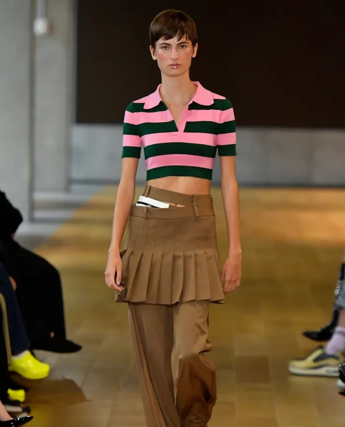This collection was reminiscent of school and pleated skirts with trousers were a fresh and unexpected trend.