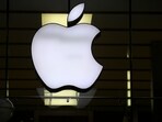 The Apple logo is illuminated at a store in the city center in Munich, Germany.