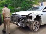 A police personnel near the damaged Audi owned by Maharashtra BJP chief Chandrashekhar Bawankule's son Sanket Bawankule. A police personnel near the damaged Audi owned by Maharashtra BJP chief Chandrashekhar Bawankule's son Sanket Bawankule.