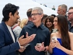 Siddharth, Tim Cook and Aditi Rao Hydari interact at Apple's It's Glowtime event.