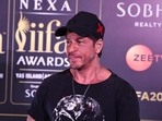 Shah Rukh Khan covered his new look with a cap.