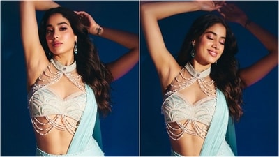 She completed her look with statement earrings featuring white pearls. With her long, luscious tresses styled in soft curls and left open in a middle partition, she looked absolutely stunning. (Instagram/@janhvikapoor) She completed her look with statement earrings featuring white pearls. With her long, luscious tresses styled in soft curls and left open in a middle partition, she looked absolutely stunning. (Instagram/@janhvikapoor)