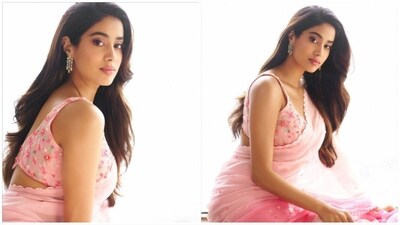Janhvi paired her saree with a matching sleeveless blouse, embellished with floral details. Assisted by celebrity stylist Ami Patel, she completed her look with a pair of statement dangling diamond earrings. (Instagram/@janhvikapoor) Janhvi paired her saree with a matching sleeveless blouse, embellished with floral details. Assisted by celebrity stylist Ami Patel, she completed her look with a pair of statement dangling diamond earrings. (Instagram/@janhvikapoor)