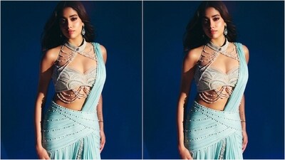 For another look, Janhvi opted for a stunning ice blue saree with a modern drape. Paired with a pearl-studded blouse, she radiated glam, draping the pallu over one shoulder and flaunting a flowy bottom, embodying apsara-like elegance. (Instagram/@janhvikapoor) For another look, Janhvi opted for a stunning ice blue saree with a modern drape. Paired with a pearl-studded blouse, she radiated glam, draping the pallu over one shoulder and flaunting a flowy bottom, embodying apsara-like elegance. (Instagram/@janhvikapoor)