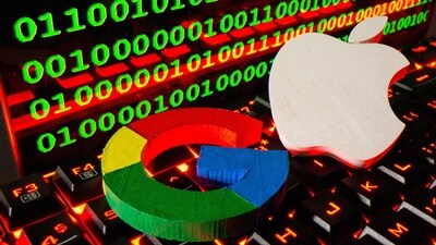 3D printed logos of Apple and Google are pictured on a keyboard in front of binary code in this illustration taken. (Reuters)