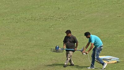 Groundsmen use a fan to dry the outfield before the start of the Test between Afghanistan and New Zealand. (AFP) Groundsmen use a fan to dry the outfield before the start of the Test between Afghanistan and New Zealand. (AFP)