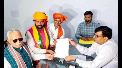 Haryana chief minister Nayab Singh Saini filed the papers before returning officer-cum-sub divisional magistrate Naseeb Kumar in the presence of Union minister and former CM Manohar Lal Khattar, Kurukshetra MP Naveen Jindal, district BJP president Ashok Gurjar, former Ladwa MLA Pawan Saini and CM’s wife Suman Saini, who filed nomination as a covering candidate. (HT Photo) Haryana chief minister Nayab Singh Saini filed the papers before returning officer-cum-sub divisional magistrate Naseeb Kumar in the presence of Union minister and former CM Manohar Lal Khattar, Kurukshetra MP Naveen Jindal, district BJP president Ashok Gurjar, former Ladwa MLA Pawan Saini and CM’s wife Suman Saini, who filed nomination as a covering candidate. (HT Photo)