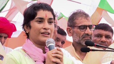 Jind: Congress candidate from Julana seat Vinesh Phogat speaks during a programme, ahead of Haryana Assembly elections, at Bakta Khera village in Jind district, Sunday, Sept. 8, 2024. (PTI Photo) (PTI) Jind: Congress candidate from Julana seat Vinesh Phogat speaks during a programme, ahead of Haryana Assembly elections, at Bakta Khera village in Jind district, Sunday, Sept. 8, 2024. (PTI Photo) (PTI)