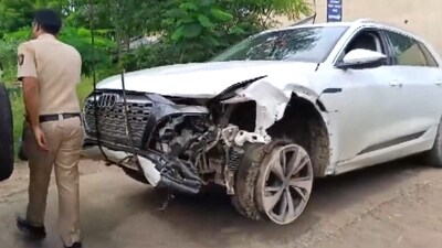 A police personnel near the damaged Audi owned by Maharashtra BJP chief Chandrashekhar Bawankule's son Sanket Bawankule. (PTI) A police personnel near the damaged Audi owned by Maharashtra BJP chief Chandrashekhar Bawankule's son Sanket Bawankule. (PTI)