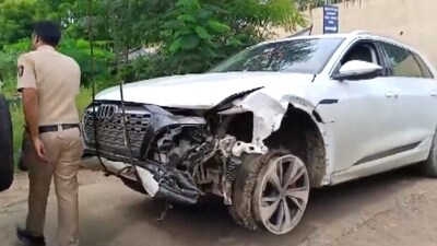 A police personnel near the damaged Audi owned by Maharashtra BJP chief Chandrashekhar Bawankule's son Sanket Bawankule. (PTI) A police personnel near the damaged Audi owned by Maharashtra BJP chief Chandrashekhar Bawankule's son Sanket Bawankule. (PTI)