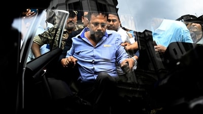 Former principal of RG Kar Medical College & Hospital Sandip Ghosh escorted by security officials being taken to Alipur CBI Court in Kolkata (Photo by Samir Jana/ Hindustan Times) (Hindustan Times) Former principal of RG Kar Medical College & Hospital Sandip Ghosh escorted by security officials being taken to Alipur CBI Court in Kolkata (Photo by Samir Jana/ Hindustan Times) (Hindustan Times)