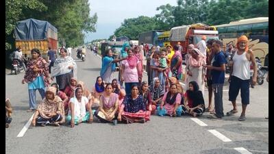 The blockade raised by villagers after the accident demanding compensation and a government job for a family member of the deceased. (HT Photo) The blockade raised by villagers after the accident demanding compensation and a government job for a family member of the deceased. (HT Photo)