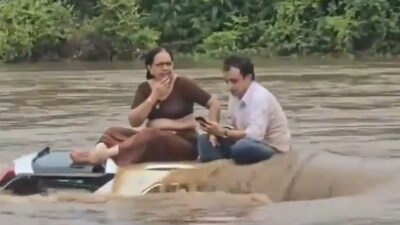 The couple was left stranded in a flash flood for two hours. The couple was left stranded in a flash flood for two hours.