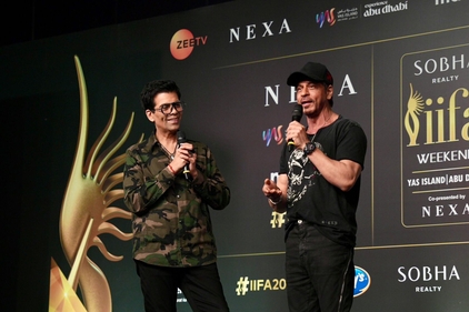 Karan Johar and Shah Rukh Khan at the IIFA press conference.