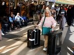 A passenger pushes her luggage as they wait for their flights during a strike by Kenya airports union workers to protest against a proposed deal for India's Adani Group ADEL.NS, to lease Jomo Kenyatta International Airport (JKIA) for 30 years, in Nairobi, Kenya.