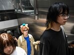  Cosplayer Xu Yunting (C), dressed as Jesse, a male character from the video game 'Light and Night',