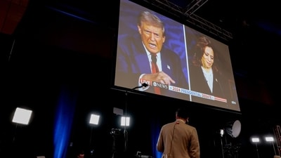 Former US President Donald Trump and US Vice President Kamala Harris are shown on screen in the spin room during the second presidential debate (Bloomberg) Former US President Donald Trump and US Vice President Kamala Harris are shown on screen in the spin room during the second presidential debate (Bloomberg)