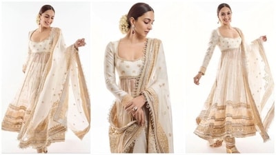 Kiara Advani's ivory anarkali is a must-bookmark for your next ethnic outfit. It features a scoop neckline, sheer bottom, and delicate golden detailing. Paired with statement earrings and gajra-adorned tresses, she looks stunning. (Instagram) Kiara Advani's ivory anarkali is a must-bookmark for your next ethnic outfit. It features a scoop neckline, sheer bottom, and delicate golden detailing. Paired with statement earrings and gajra-adorned tresses, she looks stunning. (Instagram)