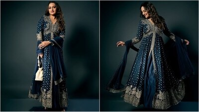 Sonakshi Sinha's ethnic look showcases a stunning blue anarkali kurta with a V-neckline, a center slit, and golden detailing throughout. Paired with a matching skirt and a potli bag, she radiates glam vibes. (Instagram) Sonakshi Sinha's ethnic look showcases a stunning blue anarkali kurta with a V-neckline, a center slit, and golden detailing throughout. Paired with a matching skirt and a potli bag, she radiates glam vibes. (Instagram)