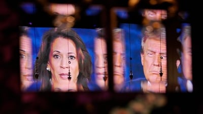Reflected in a mirror, people watch the presidential debate between Republican presidential nominee former President Donald Trump and Democratic presidential nominee Vice President Kamala Harris, Tuesday, Sept. 10, 2024, at the Gipsy Las Vegas in Las Vegas. (AP Photo/John Locher) (AP) Reflected in a mirror, people watch the presidential debate between Republican presidential nominee former President Donald Trump and Democratic presidential nominee Vice President Kamala Harris, Tuesday, Sept. 10, 2024, at the Gipsy Las Vegas in Las Vegas. (AP Photo/John Locher) (AP)