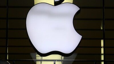 The Apple logo is illuminated at a store. (AP) The Apple logo is illuminated at a store. (AP)