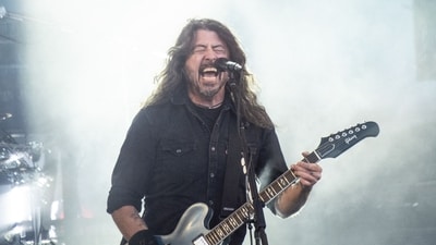 US musician Dave Grohl of rock band Foo Fighters performs on the Orange Stage at Roskilde Festival on July 5, 2024 in Roskilde, Denmark. (Photo by Helle Arensbak / Ritzau Scanpix / AFP) / Denmark OUT (AFP) US musician Dave Grohl of rock band Foo Fighters performs on the Orange Stage at Roskilde Festival on July 5, 2024 in Roskilde, Denmark. (Photo by Helle Arensbak / Ritzau Scanpix / AFP) / Denmark OUT (AFP)