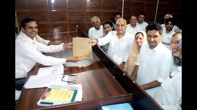 Former Haryana chief minister and leader of Opposition Bhupinder Singh Hooda on Wednesday filed nomination for Haryana assembly polls from his traditional stronghold Garhi- Sampla-Kiloi in Rohtak and sought voters’ support in “throwing the BJP out of power” in a head-to-head contest. (HT Photo)