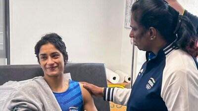Indian Olympics Association (IOA) President PT Usha meets wrestler Vinesh Phogat after the latter was hospitalised following her disqualification from the Paris Olympics (PTI) Indian Olympics Association (IOA) President PT Usha meets wrestler Vinesh Phogat after the latter was hospitalised following her disqualification from the Paris Olympics (PTI)