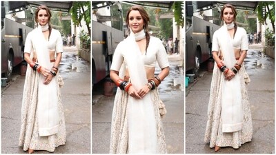 Triptii Dimri’s latest look perfectly blends ethnic elegance with modern charm, as she stuns in an ivory lehenga paired with a brown belt and a matching duppata wrapped stylishly around her neck. (HT photo/VarinderChawla) Triptii Dimri’s latest look perfectly blends ethnic elegance with modern charm, as she stuns in an ivory lehenga paired with a brown belt and a matching duppata wrapped stylishly around her neck. (HT photo/VarinderChawla)