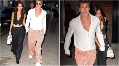 Brad Pitt and Ines de Ramon are enjoying the last days of summer. Pitt opted for a breezy white button-down, partially unbuttoned to show off layered necklaces, including a diamond "I" pendant. Ines stunned in a plunging black cropped vest with matching black pants. (Instagram/@JustJared) Brad Pitt and Ines de Ramon are enjoying the last days of summer. Pitt opted for a breezy white button-down, partially unbuttoned to show off layered necklaces, including a diamond "I" pendant. Ines stunned in a plunging black cropped vest with matching black pants. (Instagram/@JustJared)