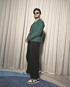 The actor ups his style stakes in a green jacket paired with black flared pants from Dhruv Vaish, rounded off with tinted sunnies (Abhishek Gaikwad) The actor ups his style stakes in a green jacket paired with black flared pants from Dhruv Vaish, rounded off with tinted sunnies (Abhishek Gaikwad)