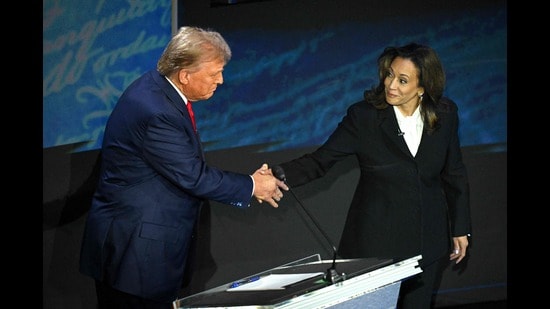 US Vice President and Democratic presidential candidate Kamala Harris (R) shakes hands with former US President and Republican presidential candidate Donald Trump during a presidential debate at the National Constitution Center in Philadelphia, Pennsylvania, on Tuesday. (AFP)