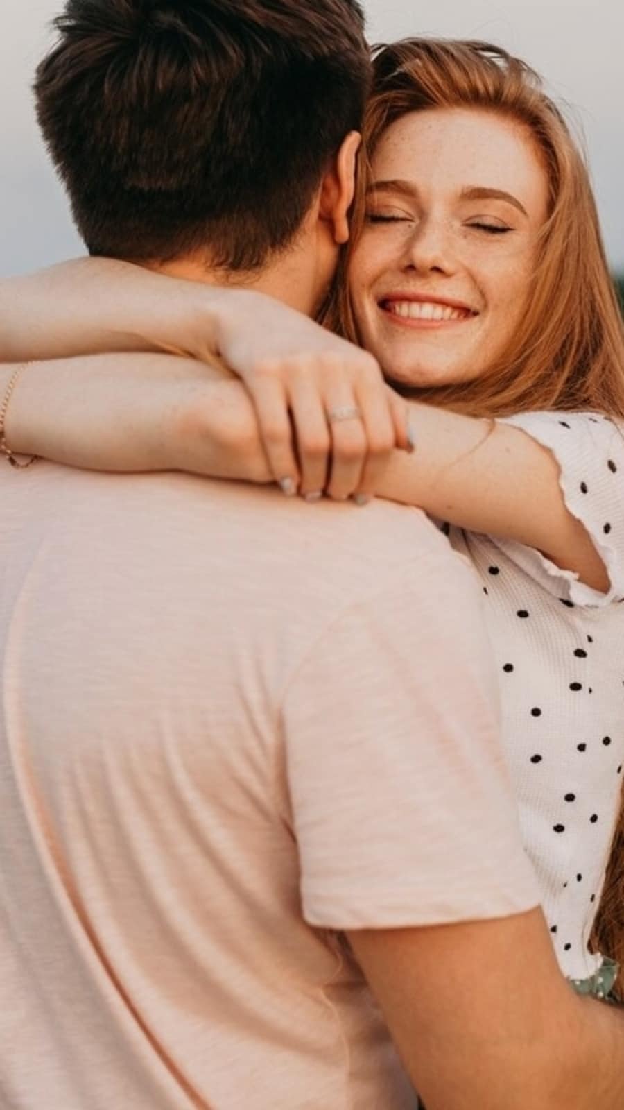 man_hugging_woman