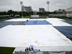 The covered field is pictured as it rains at the start of the one-off Test cricket match between Afghanistan and New Zealand at the Shaheed Vijay Singh Pathik Sports Complex in Greater Noida on September 12, 2024 The covered field is pictured as it rains at the start of the one-off Test cricket match between Afghanistan and New Zealand at the Shaheed Vijay Singh Pathik Sports Complex in Greater Noida on September 12, 2024