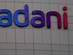 Bangladesh's interim government plans to scrutinize contracts with Indian firms like Adani Group, as they seek to expedite the clearance of $800 million owed for power supply, ensuring compliance with local laws.