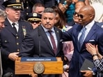Edward A. Caban, centre, speaks after being sworn in as NYPD police commissioner outside New York City Police Department 40th Precinct on Monday, July 17, 2023, in New York. Mayor Eric Adams on the right.