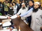 Representatives of Masjid committee submit a memorandum to the Shimla Municipal Corporation Commissioner Bhupender Kumar Attri over the alleged illegal structure in a mosque, at Sanjauli in Shimla, Thursday.