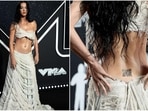 Katy Perry stunned at the 2024 MTV VMAs with a unique QR code tattoo on her back.