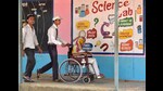 New Delhi, India - May 12, 2019: A school student Pardeep helps an elderly woman during the Lok Sabha election at Senior Sec.School, Sanjay Colony Bhati Mines, in New Delhi, India, on Sunday, May 12, 2019. (Photo by Sanjeev Verma/ Hindustan Times) (Sanjeev Verma/HT PHOTO)