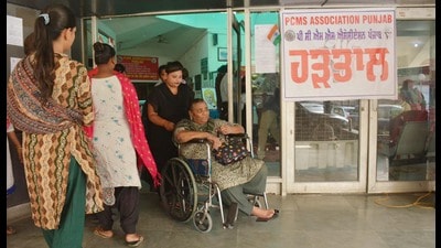 A patient on a wheelchair with attended to by his relatives coming out from during a doctors strike in support of their demands at Civil hospital. Amritsar, India, on Thursday, September 12, 2024. (Sameer Sehgal/Hindustan Times) A patient on a wheelchair with attended to by his relatives coming out from during a doctors strike in support of their demands at Civil hospital. Amritsar, India, on Thursday, September 12, 2024. (Sameer Sehgal/Hindustan Times)