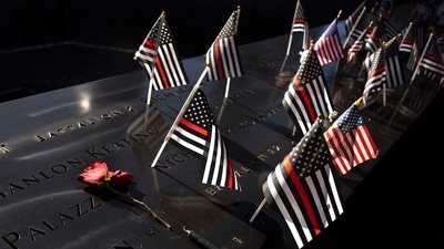 Flags and flowers were placed as tributes next to the names of martyrs in the attacks which took place on September 11, 2001. The names of victims are inscribed on 152 bronze para-pets on the memorial pools. (AP Photo/Yuki Iwamura) Flags and flowers were placed as tributes next to the names of martyrs in the attacks which took place on September 11, 2001. The names of victims are inscribed on 152 bronze para-pets on the memorial pools. (AP Photo/Yuki Iwamura)