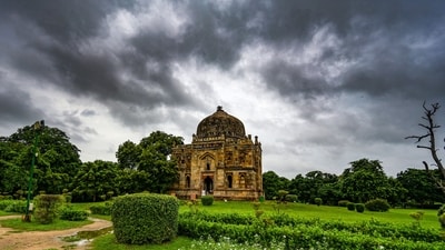 Dark clouds seen hovering over the skies at Lodhi gardens in New Delhi on Thursday.  (Photo by RAJ K RAJ / Hindustan Times (RAJ K RAJ /HT PHOTO)