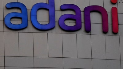 Bangladesh's interim government plans to scrutinize contracts with Indian firms like Adani Group, as they seek to expedite the clearance of $800 million owed for power supply, ensuring compliance with local laws. (Reuters)