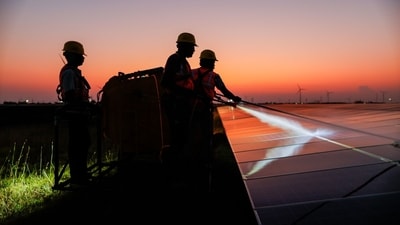 Workers clean solar panels after sunset at the 100 MW solar power plants operated by Ayana Renewable Power Pvt. in Tuticorin, India on Tuesday, March 19, 2024. Photographer: Prashanth Vishwanathan/Bloomberg (Bloomberg) Workers clean solar panels after sunset at the 100 MW solar power plants operated by Ayana Renewable Power Pvt. in Tuticorin, India on Tuesday, March 19, 2024. Photographer: Prashanth Vishwanathan/Bloomberg (Bloomberg)