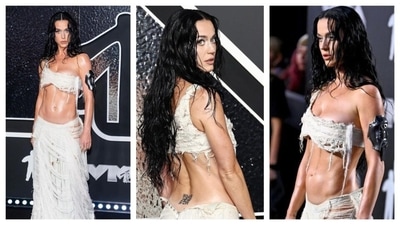 Katy Perry who lately is all for risque looks that raise the temperature, wore a dress that made her look like a hot dystopian mummy with a one-shoulder white tattered top with frayed ends and skirt. It exposed her midriff and revealed a QR code at the waist, perfectly playing along with the futuristic fashion theme. (Instagram) Katy Perry who lately is all for risque looks that raise the temperature, wore a dress that made her look like a hot dystopian mummy with a one-shoulder white tattered top with frayed ends and skirt. It exposed her midriff and revealed a QR code at the waist, perfectly playing along with the futuristic fashion theme. (Instagram)