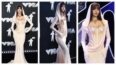 Lisa's outfit turned heads as if she walked straight out of a fantasy novel. She wore a white gown by Mugler, featuring a corset bodice. The bodice's nude color almost melted into her skin, giving the gown a risqué and sheer appearance. She also donned a matching veil attached to her full-sleeved gloves. She accessorized with a golden choker that resembled a snake coiled around her neck. Blackpink's Lisa bagged the best K-pop award. (Instagram) Lisa's outfit turned heads as if she walked straight out of a fantasy novel. She wore a white gown by Mugler, featuring a corset bodice. The bodice's nude color almost melted into her skin, giving the gown a risqué and sheer appearance. She also donned a matching veil attached to her full-sleeved gloves. She accessorized with a golden choker that resembled a snake coiled around her neck. Blackpink's Lisa bagged the best K-pop award. (Instagram)