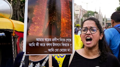 Doctors display placards during a protest dharna over the RG Kar Hospital rape and murder incident in Kolkata. (PTI) Doctors display placards during a protest dharna over the RG Kar Hospital rape and murder incident in Kolkata. (PTI)