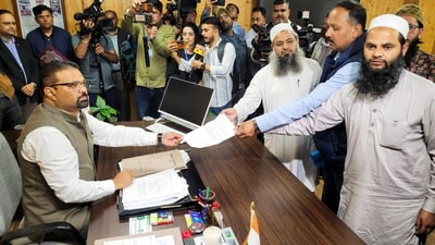 Representatives of Masjid committee submit a memorandum to the Shimla Municipal Corporation Commissioner Bhupender Kumar Attri over the alleged illegal structure in a mosque, at Sanjauli in Shimla, Thursday. (PTI) Representatives of Masjid committee submit a memorandum to the Shimla Municipal Corporation Commissioner Bhupender Kumar Attri over the alleged illegal structure in a mosque, at Sanjauli in Shimla, Thursday. (PTI)