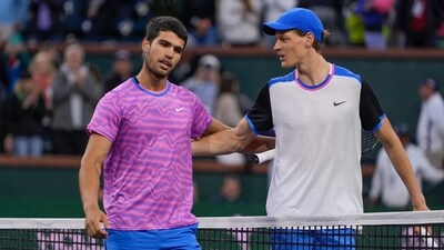 Carlos Alcaraz, of Spain, left, talks with Jannik Sinner, of Italy, after a match. (AP)
